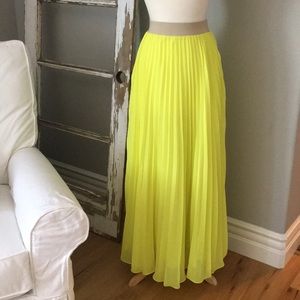 Green pleated maxi skirt